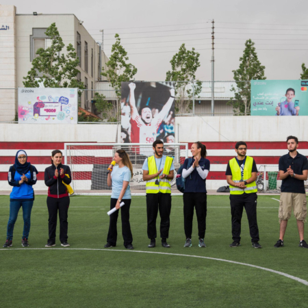 Celebrating the winners of a girls' soccer match in Jordan